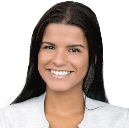Young woman grinning and wearing white shirt