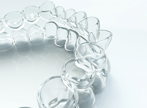 Closeup of beautiful, clean Invisalign in Cary on white background