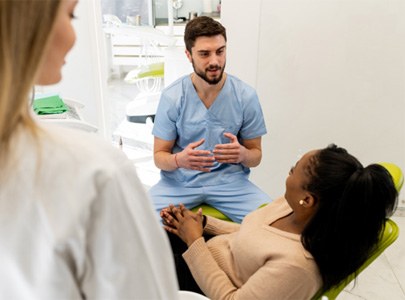 Dentist explaining root canal therapy in Cary to patient