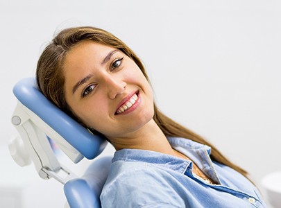 Female patient sitting back in a dental chair