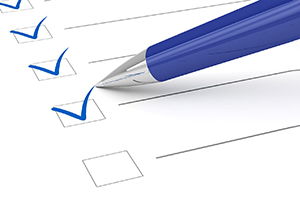 pen filling out checklist