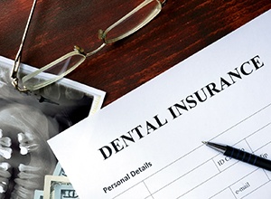 Dental insurance paperwork for the cost of dental emergencies in Cary