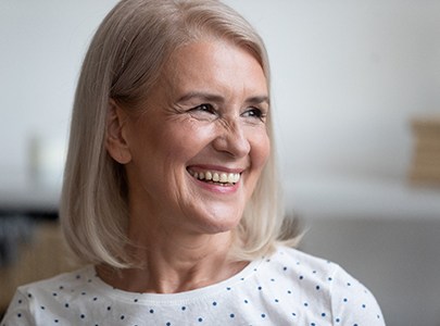 woman smiling after getting dental implants in Cary