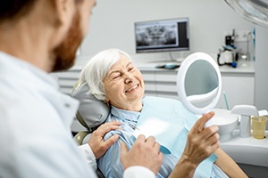 patient smiling after getting dental implants in Cary