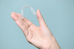 Patient holding clear aligner