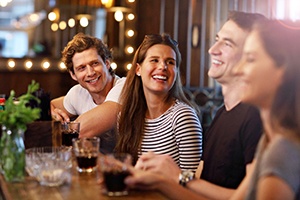 Group of friends smiling at restaurant