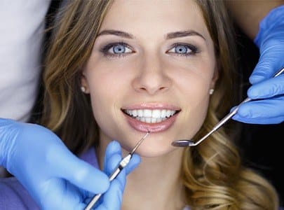 Woman receiving dental checkup