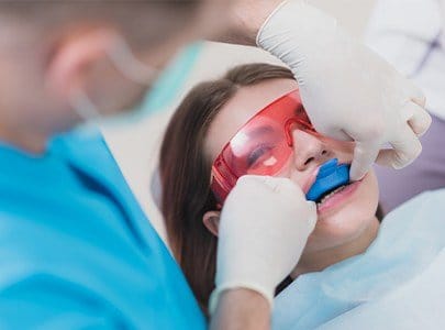 Child receiving fluoride treatment