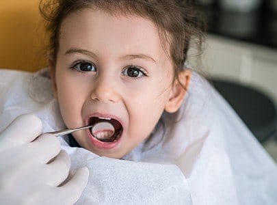 Child receiving dental checkup