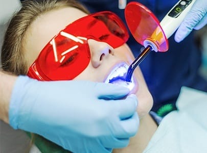 Woman receiving dental sealants