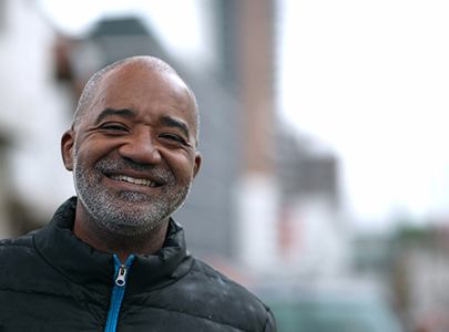 older man smiling after full mouth reconstruction 