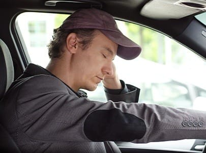 Man in need of sleep apnea therapy falling asleep behind the wheel