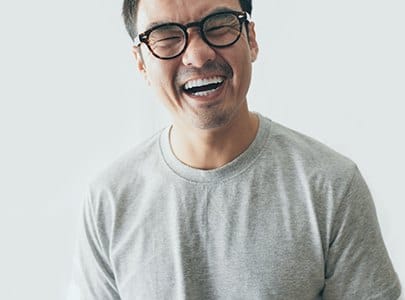 laughing person in glasses