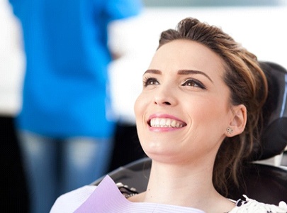 woman smiling after professional teeth whitening in Cary