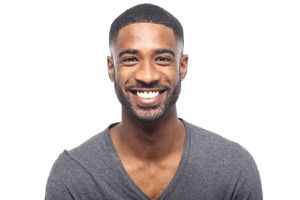 man with white teeth grinning