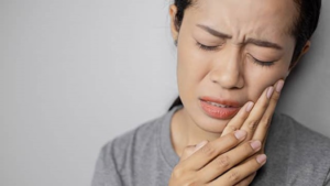 a patient suffering from facial pain